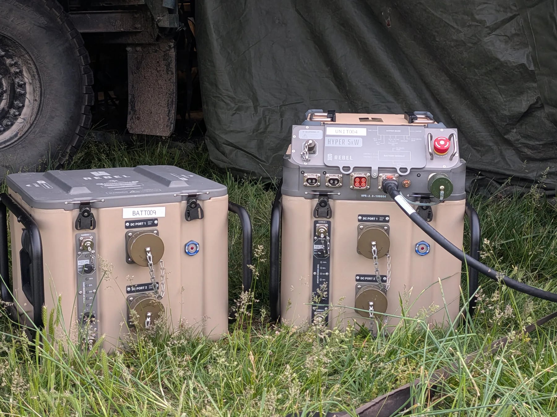 Close-up of HYPER™ power and battery module units deployed in grass