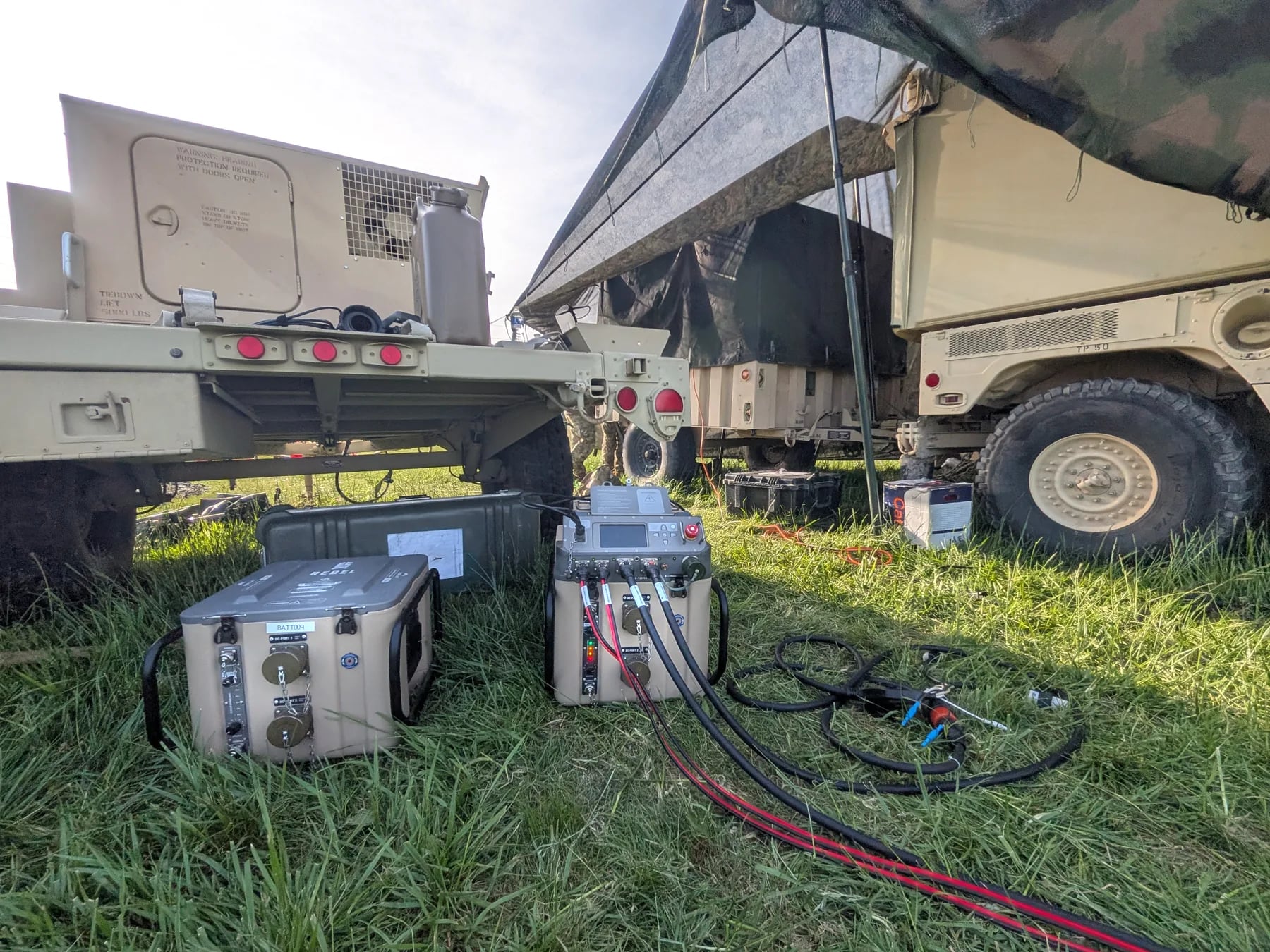 HYPER™ power and battery module units deployed near military vehicles